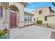 Inviting front entrance with a beautiful, modern wooden door and drought-resistant landscaping at 4020 Recktenwall Ave, North Las Vegas, NV 89081