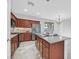 Modern kitchen with stainless steel appliances, granite counters, and a kitchen island at 4020 Recktenwall Ave, North Las Vegas, NV 89081