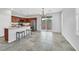 Bright and spacious kitchen with an island, stainless steel appliances, and backyard access at 4020 Recktenwall Ave, North Las Vegas, NV 89081