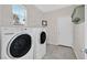 Bright laundry room featuring modern washer and dryer units at 4020 Recktenwall Ave, North Las Vegas, NV 89081
