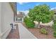 A lovely side yard featuring desert landscaping and attractive foliage at 4020 Recktenwall Ave, North Las Vegas, NV 89081