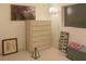 Bedroom decoration featuring a white dresser, butterfly wall art, pictures and an art pyramid at 4178 Matterhorn Way, Las Vegas, NV 89124