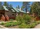 Two-story home featuring a spacious wood deck, green metal roof, and well-maintained landscaping at 4178 Matterhorn Way, Las Vegas, NV 89124