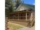Charming home with a spacious covered porch, wood details, and manicured lawn at 4178 Matterhorn Way, Las Vegas, NV 89124