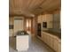 A bright kitchen featuring granite countertops, wood ceilings, and stainless steel appliances at 4178 Matterhorn Way, Las Vegas, NV 89124