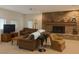 Cozy living room with stone fireplace and neutral furnishings at 4178 Matterhorn Way, Las Vegas, NV 89124