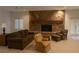 Cozy living room with stone fireplace and neutral furnishings at 4178 Matterhorn Way, Las Vegas, NV 89124