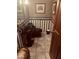 Powder room with black fixtures, wainscotting and striped wallpaper at 4178 Matterhorn Way, Las Vegas, NV 89124