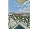 Stunning balcony view showcases the city skyline and neighborhood treetops below under a bright blue sky at 4381 W Flamingo Rd # 2022, Las Vegas, NV 89103