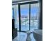 Modern bathroom featuring a soaking tub and a view of the city skyline at 4381 W Flamingo Rd # 2022, Las Vegas, NV 89103