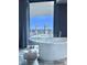 Luxurious bathroom with a freestanding tub and panoramic city views at 4381 W Flamingo Rd # 2022, Las Vegas, NV 89103