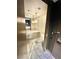 Modern bathroom featuring a vessel sink, marble floors, and stylish lighting at 4381 W Flamingo Rd # 2022, Las Vegas, NV 89103