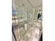 Modern bathroom featuring a glass-enclosed shower with marble tile surround at 4381 W Flamingo Rd # 2022, Las Vegas, NV 89103