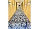 The brightly lit hallway features elegant, patterned carpeting and neutral walls at 4381 W Flamingo Rd # 2022, Las Vegas, NV 89103