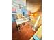 This room features a modern workspace with a glass desk and stylish lighting at 4381 W Flamingo Rd # 2022, Las Vegas, NV 89103
