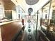 Restaurant with modern lighting, black floors, and view to outside at 4381 W Flamingo Rd # 2022, Las Vegas, NV 89103
