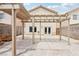 Spacious backyard featuring a covered patio, offering shade and an outdoor living space for relaxation and entertainment at 4552 Aviation St, Las Vegas, NV 89115