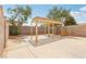 Spacious backyard featuring a pergola and concrete slab, perfect for outdoor living at 4552 Aviation St, Las Vegas, NV 89115