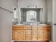 Bathroom vanity with dual sinks, granite countertops, and custom cabinetry at 4552 Aviation St, Las Vegas, NV 89115