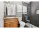 Bathroom with tiled shower, updated vanity, and modern fixtures at 4552 Aviation St, Las Vegas, NV 89115