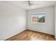 Bedroom with natural light, ceiling fan, and wood-look flooring at 4552 Aviation St, Las Vegas, NV 89115