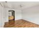 Bedroom with archway to vanity, wood-look floors, and neutral decor at 4552 Aviation St, Las Vegas, NV 89115