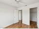 A bedroom featuring a ceiling fan, wood-look flooring and closet space at 4552 Aviation St, Las Vegas, NV 89115