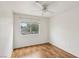 Light, bright bedroom with wood-look flooring and a window, offering natural light at 4552 Aviation St, Las Vegas, NV 89115