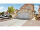Charming two-story home featuring a spacious driveway leading to a two-car garage at 4552 Aviation St, Las Vegas, NV 89115