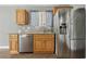 Updated kitchen with stainless steel appliances, wood cabinets, and granite counters at 4552 Aviation St, Las Vegas, NV 89115