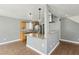 Well-lit kitchen with wood cabinets, granite counters and eat-in breakfast bar at 4552 Aviation St, Las Vegas, NV 89115