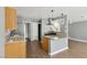 Kitchen with granite counters, stainless appliances, and wood-look flooring at 4552 Aviation St, Las Vegas, NV 89115