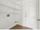 Laundry room with shelving, utility hookups, and access door to the outside at 4552 Aviation St, Las Vegas, NV 89115