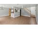 Spacious living area featuring an open layout, wood floors, and staircase access at 4552 Aviation St, Las Vegas, NV 89115