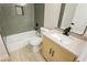Features a tub with gray tile surround, a modern vanity, and updated fixtures at 4810 Grey Wolf Ln # 104, Las Vegas, NV 89149