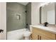 Modern bathroom featuring a tiled shower/tub combo, sleek vanity, and modern fixtures at 4810 Grey Wolf Ln # 104, Las Vegas, NV 89149
