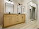 Modern bathroom featuring a double vanity, modern fixtures, tile flooring, and walk in shower at 4810 Grey Wolf Ln # 104, Las Vegas, NV 89149