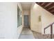 Welcoming front entrance with security door, neutral stucco, and convenient fire extinguisher at 4810 Grey Wolf Ln # 104, Las Vegas, NV 89149