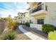 Stunning townhouses featuring private balconies, landscaped common areas, and inviting walkways at 4810 Grey Wolf Ln # 104, Las Vegas, NV 89149