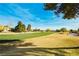 Scenic golf course view with manicured greens and fairways against a bright blue sky at 4810 Grey Wolf Ln # 104, Las Vegas, NV 89149