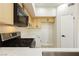 Kitchen features stainless steel oven, black microwave and blond cabinets at 4810 Grey Wolf Ln # 104, Las Vegas, NV 89149