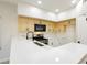 Modern kitchen featuring new countertops, cabinets, stainless steel appliances, and updated lighting at 4810 Grey Wolf Ln # 104, Las Vegas, NV 89149