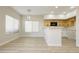 Bright kitchen features modern appliances, sleek countertops and wooden cabinetry at 4810 Grey Wolf Ln # 104, Las Vegas, NV 89149