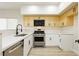 Modern kitchen with stainless steel appliances and sleek white countertops at 4810 Grey Wolf Ln # 104, Las Vegas, NV 89149