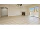 Spacious living room with modern fireplace and sliding glass door to patio at 4810 Grey Wolf Ln # 104, Las Vegas, NV 89149