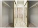 Walk-in closet features a view to a remodeled bathroom at 4810 Grey Wolf Ln # 104, Las Vegas, NV 89149