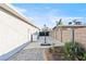 The backyard has ample patio space and mature plants at 5004 Cannon Blvd, Las Vegas, NV 89108