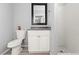 Bathroom featuring a tiled shower, modern toilet and a white vanity at 5004 Cannon Blvd, Las Vegas, NV 89108