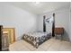 This bedroom has tile flooring and a neutral-toned bedspread at 5004 Cannon Blvd, Las Vegas, NV 89108