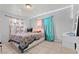 Bright bedroom with multicolored curtains, decorative lighting, and tile flooring at 5004 Cannon Blvd, Las Vegas, NV 89108